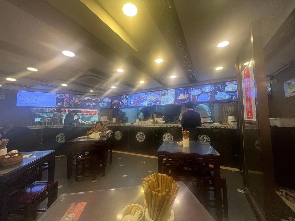 The ground-floor noodle hall at De Xing Guan — fast-paced, standing-room-only, the heart of old Shanghai dining