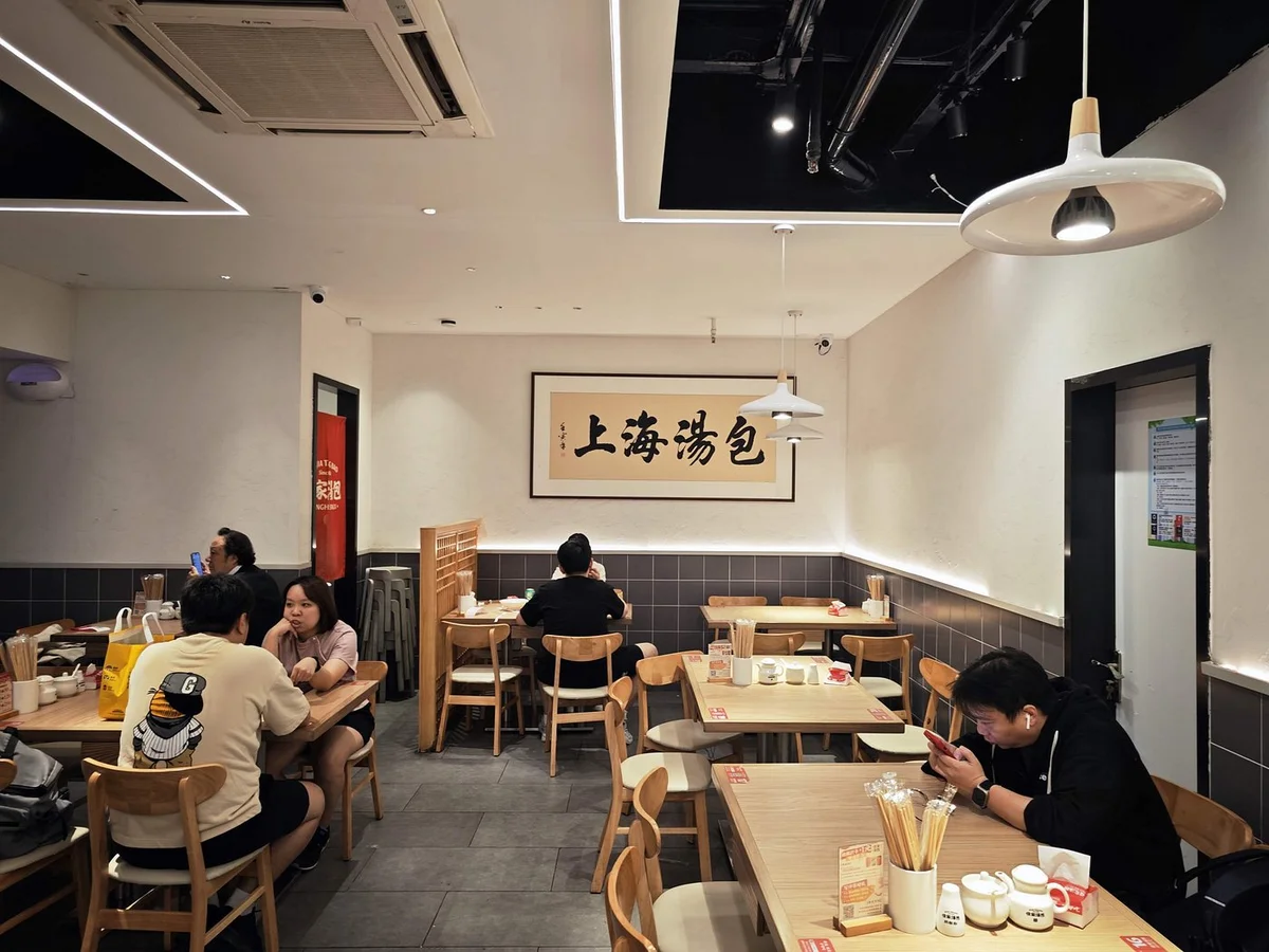 The no-frills interior — plastic stools and laminated tables, all about the dumplings