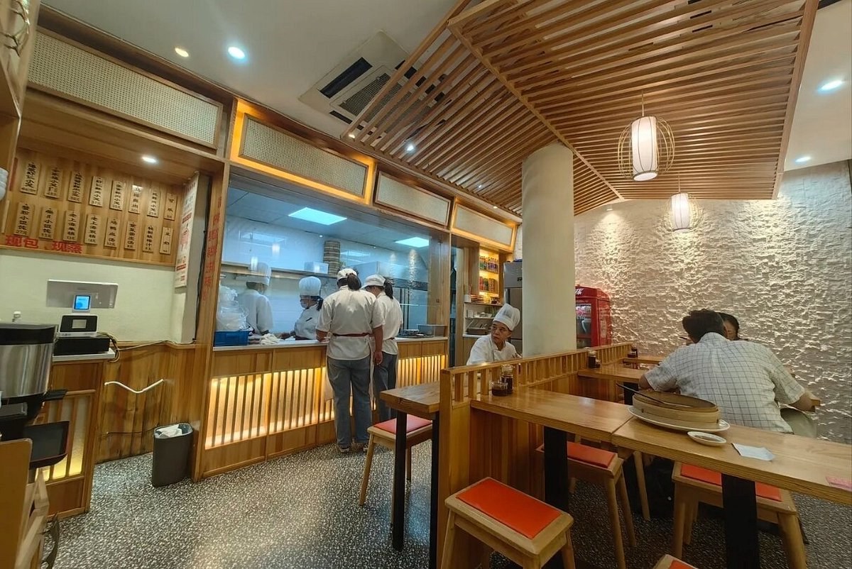 Steamers hissing with fresh xiaolongbao — this is where the magic happens
