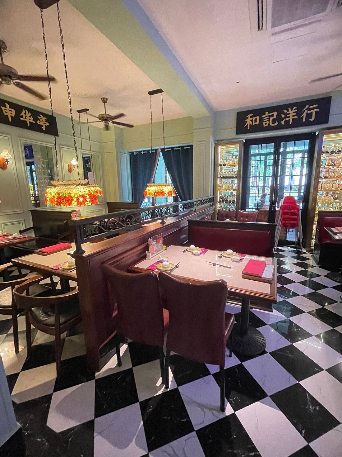 The main dining room — 1930s Shanghai nostalgia with art deco details, stained glass, and vintage booths
